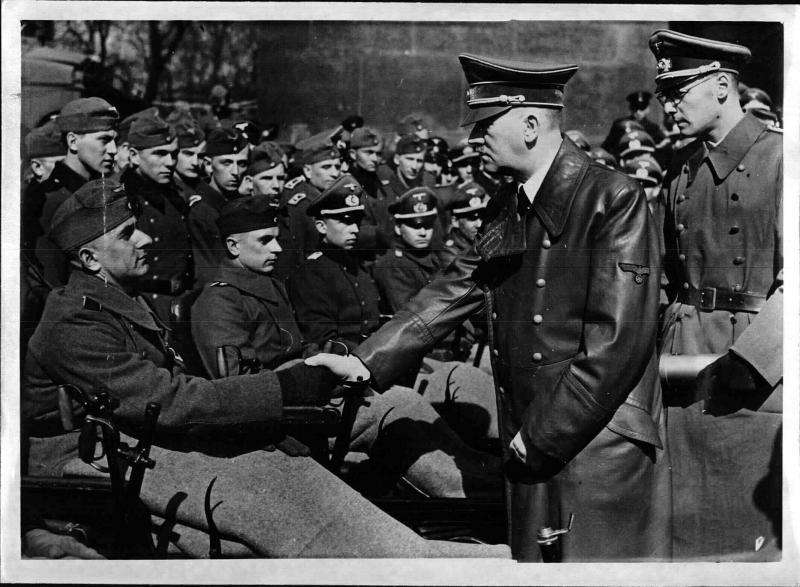 Adolf Hitler greets wounded soldiers during the Heldengedenktag (Heroes Memorial Day) in Berlin